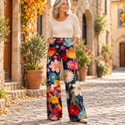 Δροσούλα | Φαρδύ παντελόνι boho με μεγάλα πολύχρωμα λουλούδια σε σκούρο μπλε