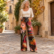 Κάλλια | Φαρδύ παντελόνι boho με ροζ λουλούδια και πορτοκαλί μοτίβα σε μαύρο